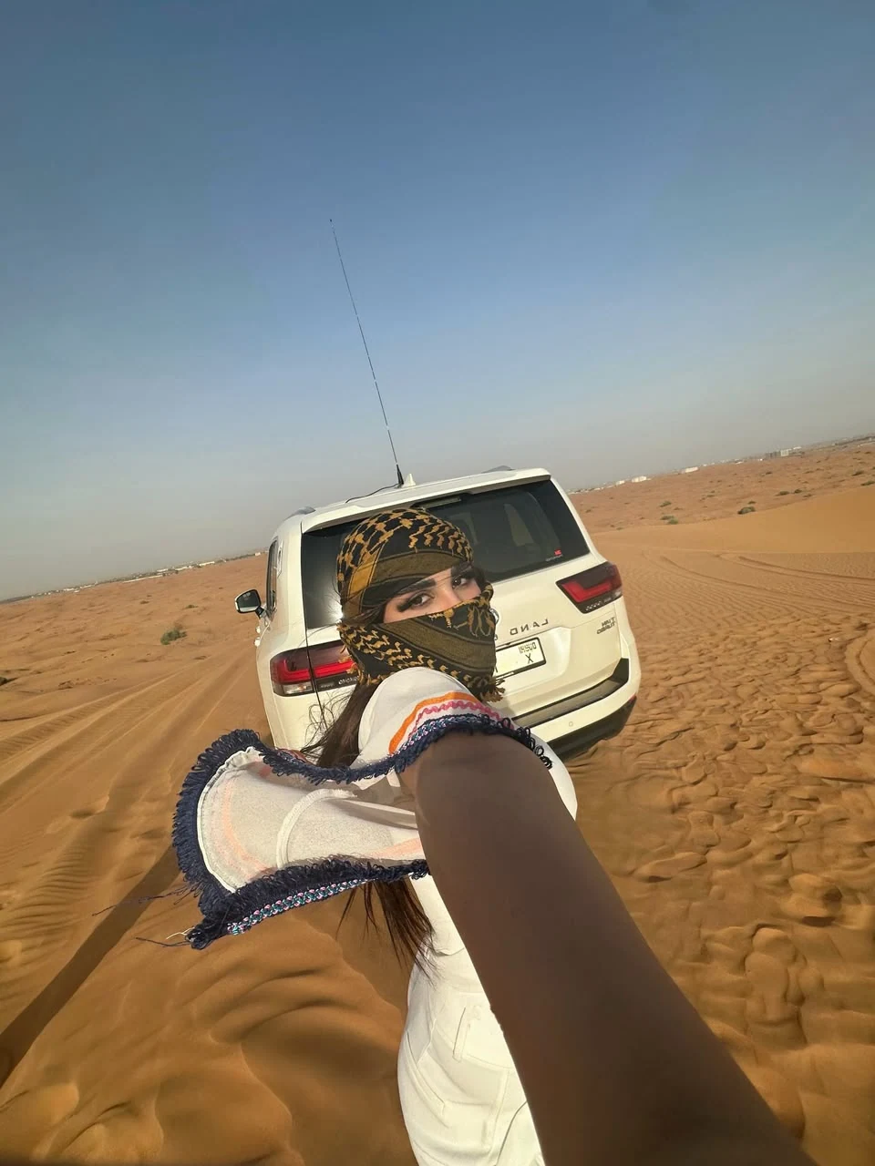 View toward a 4x4 vehicle on the Dubai sand dunes
